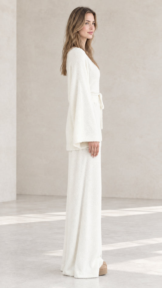 Off-white fuzzy knit loungewear set side view showing belted longline cardigan