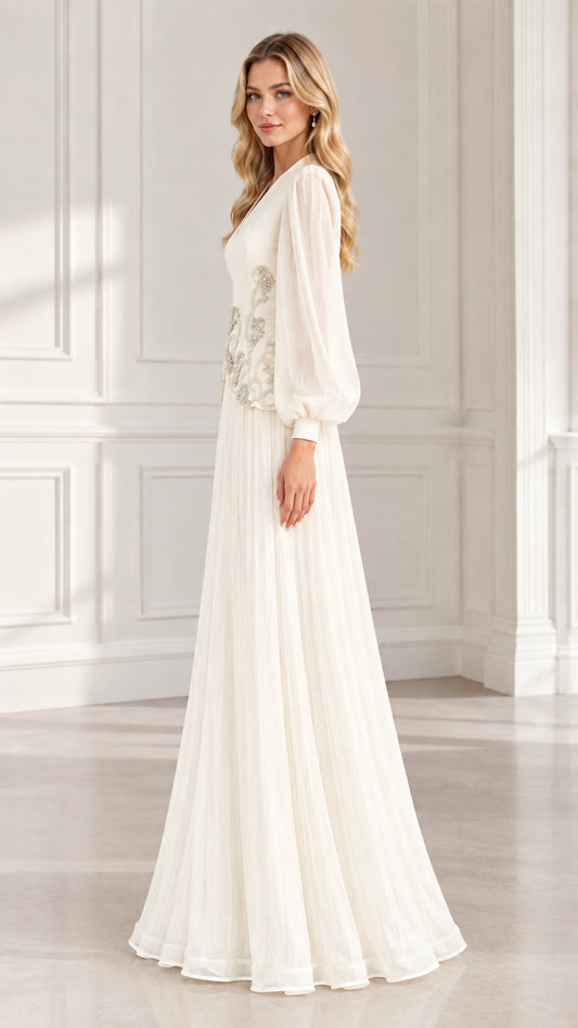 Side profile view of ivory pleated formal evening dress with long sheer sleeves