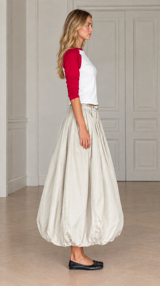 Side profile view of women's balloon maxi skirt and raglan sleeve top in red and cream