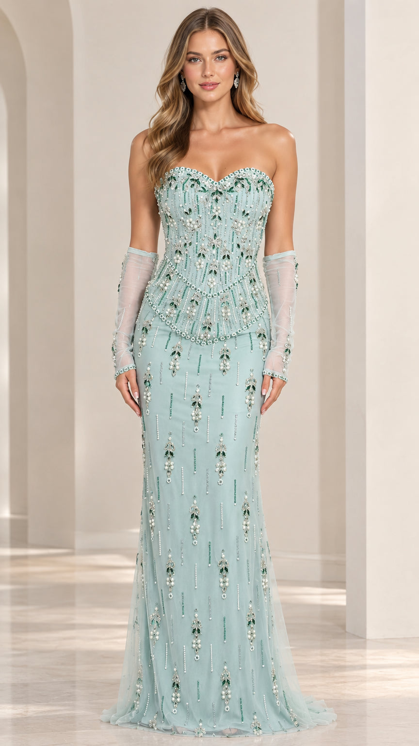 Front full-length view of model in mint green strapless beaded corset evening gown with opera gloves