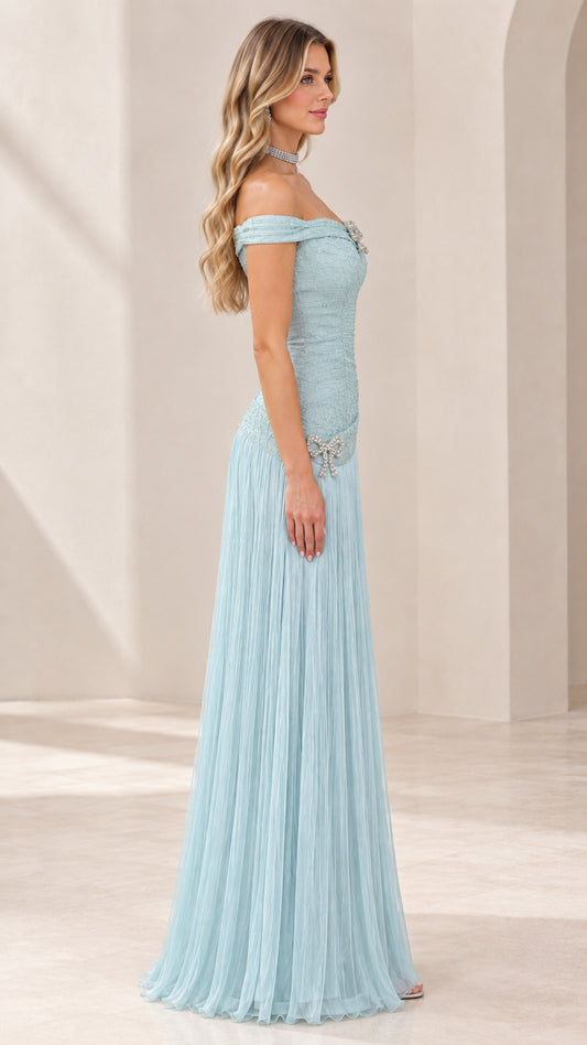 Side profile of ice blue formal maxi gown showing fitted ruched bodice and flowing skirt