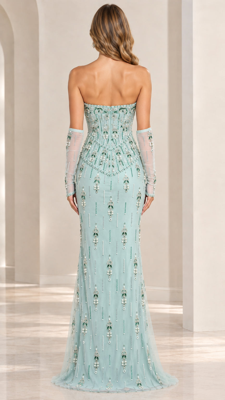 Back view of model wearing mint green strapless floor-length beaded evening gown