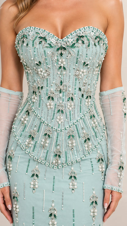 Close-up detail of sweetheart neckline and intricate beaded corset bodice with matching gloves